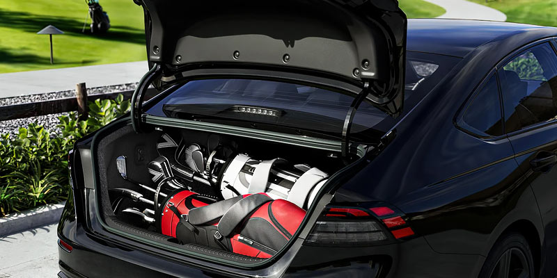 the trunk of the 2025 Honda Accord with 2 sets of golf clubs stored in it