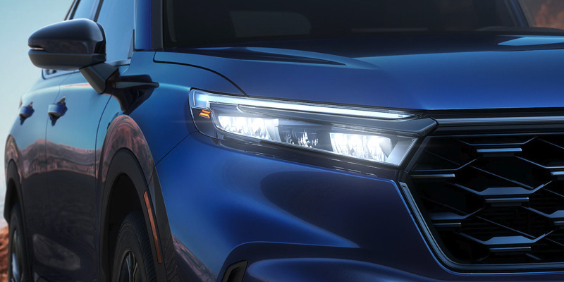 the headlight shining on a 2025 Honda CR-V Hybrid