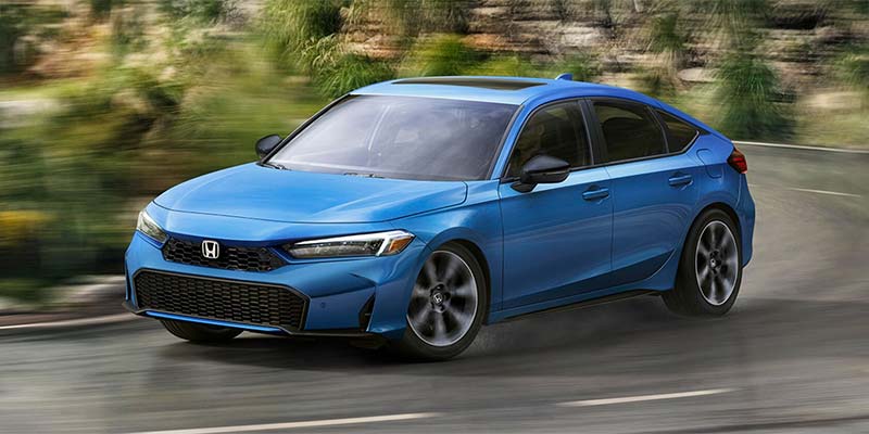 Blue 2025 Honda Civic Hybrid Taking a Corner