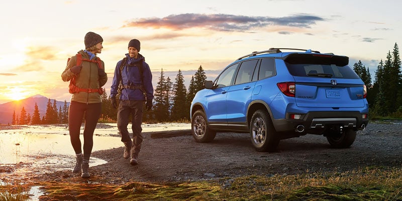 Blue 2025 Honda Passport at the Lake